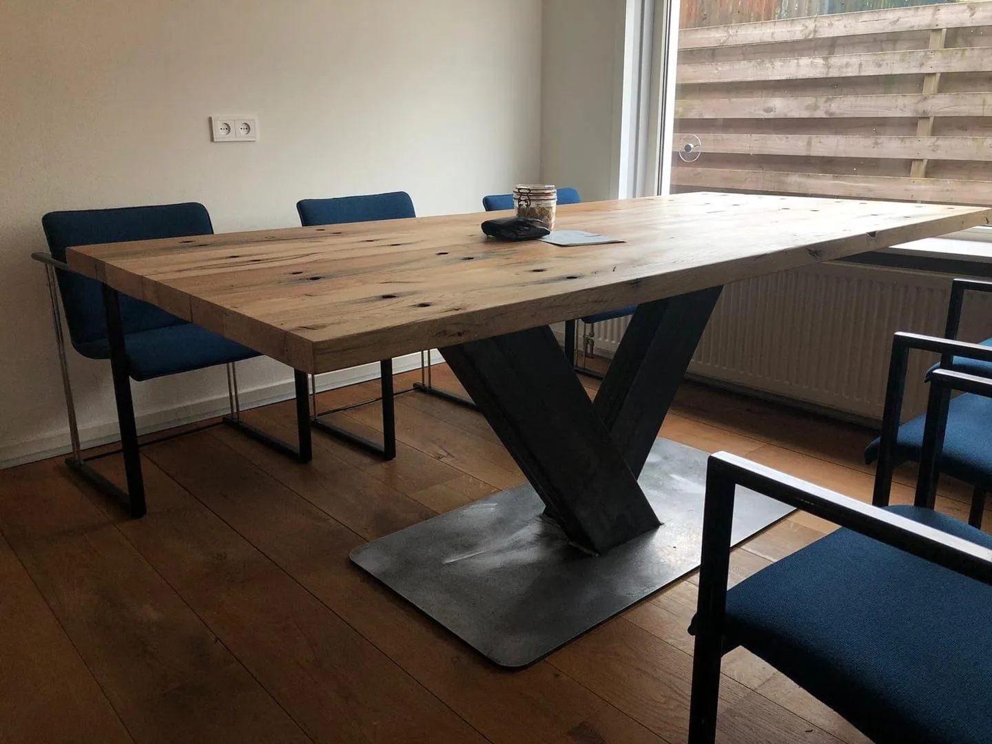 table with wooden top and steel base