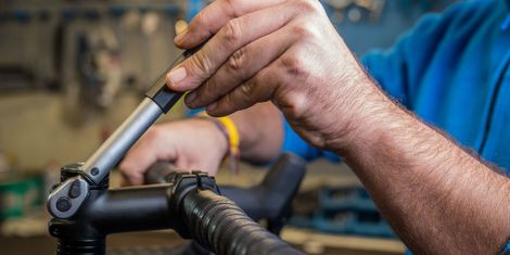 What is a torque wrench, and how do you use it?