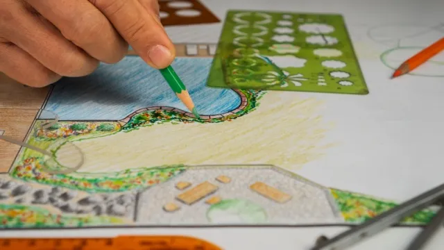 man draws garden plan