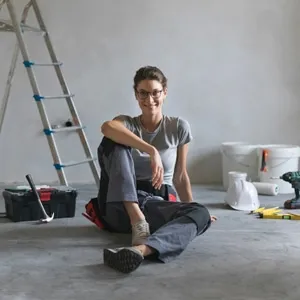 happy woman in freshly painted room